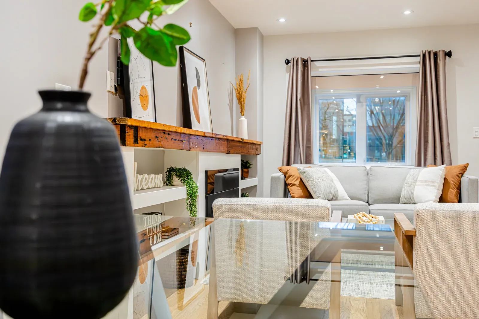 a living room with a couch and a glass table